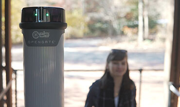 OPENGATE security system with a woman in the background