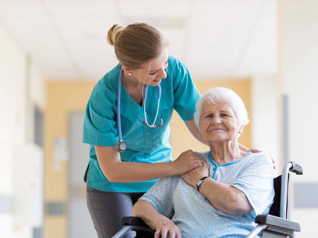 A nurse caring for an older woman.