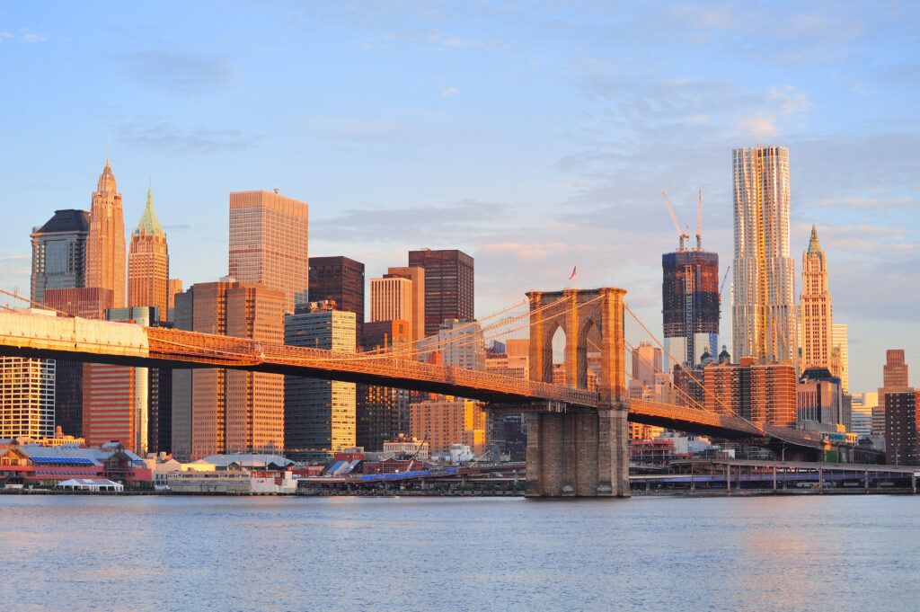 New York City skyline with the Brooklyn Bridge in the center.