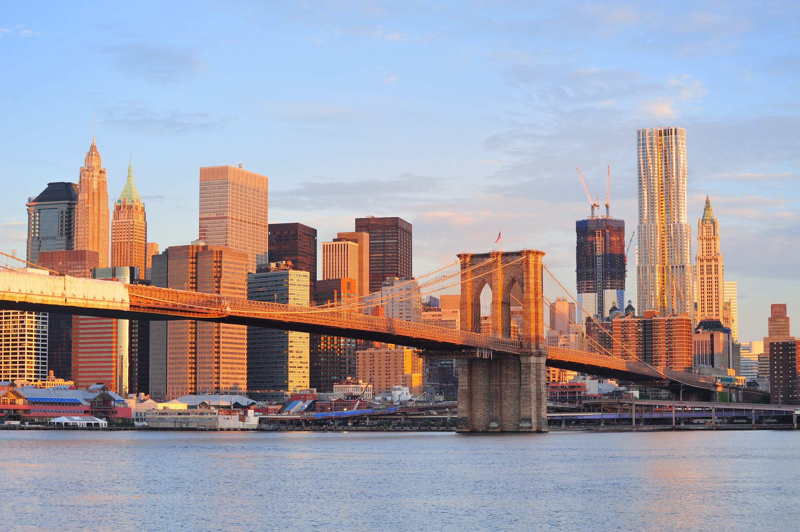 New York City skyline with the Brooklyn Bridge in the center.
